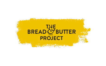 Black The Bread and Butter Project text logo with yellow paint strokes behind